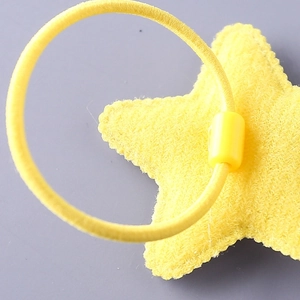 Elastic yellow hair tie for kids featuring a vibrant star-shaped felt accessory