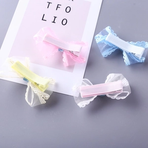 Set of four pastel lace mesh bow hair clips in pink, blue, yellow, and white colors