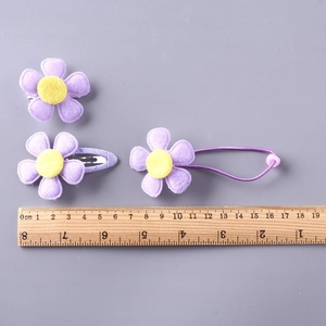 Pack of 10 purple fabric flower hair clips and elastic ties for girls and toddlers