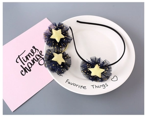 Detail of 3-piece navy mesh star hair accessories set with gold glitter star accents
