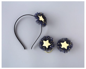 Detail view of 3-piece navy blue star mesh hair accessories set for young girls