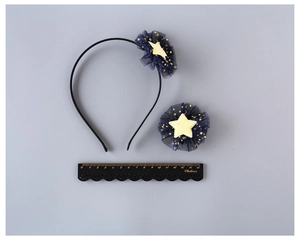 Detail of 3-piece navy mesh hair accessories with gold stars and measurement ruler
