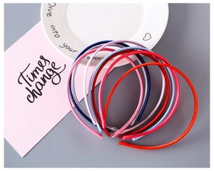 Close-up of colorful 1cm fabric covered plastic headbands set for girls and DIY hair crafts