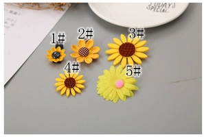 Detail showing five different sunflower hair clip designs in various textures and styles