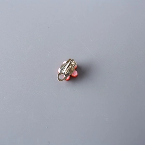Pink heart-shaped clip-on earring for girls with glitter finish and silver U-clip