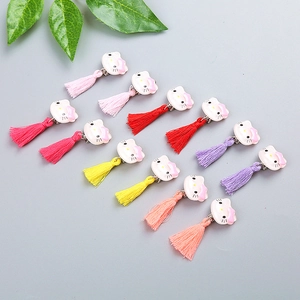 Detailed set of Hello Kitty themed kids resin ear clips with colorful fiber tassels