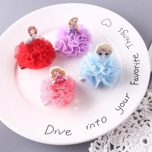 Detailed view of four colorful princess tulle hair clips with cute cartoon characters