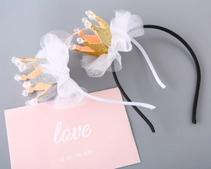 Detail of glitter princess crown headbands with mesh veils for girls' party hair accessories