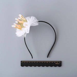Sparkly gold crown headband for girls with white lace ruffles and glitter crown detail