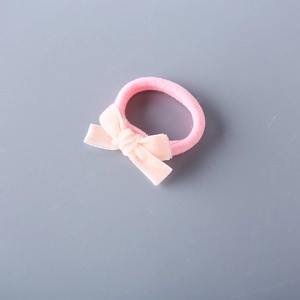 Pink velvet bow hair tie for girls featuring a high-elastic rope on a clean gray background
