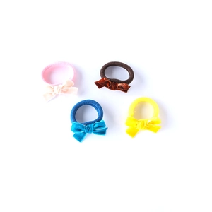 Set of four velvet bow hair ties for girls in pink, brown, blue, and yellow colors