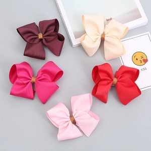 Set of five handmade ribbed ribbon bow hair clips in vibrant colors with gold centers