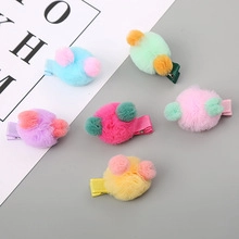 Set of six colorful plush ball hair clips for girls in pastel blue green and pink