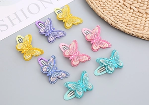 Macro detail of 8-pack butterfly hair clips with shimmering rhinestones for girls