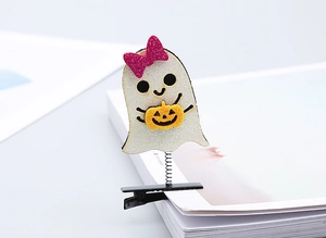 Detail of glittery ghost hair clip with spring and pink bow for Halloween parties
