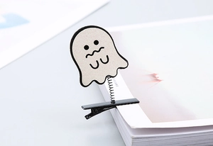 Detail of cute Halloween ghost clip with shaking spring and black sequin duckbill clamp
