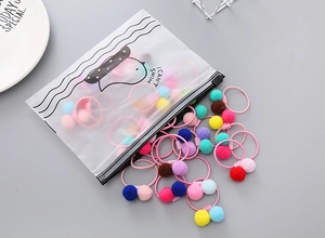 Colorful pom-pom hair ties in a frosted zipper pouch for girls' hair styling