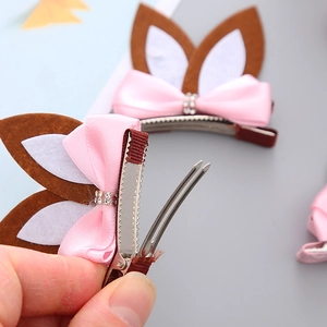 Cute bunny ear hair clip with pink bow and metallic duckbill clip for girls