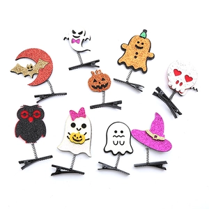 Set of 9 glitter Halloween hair clips with pumpkin ghost and bat spring designs