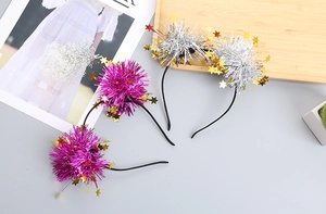 Close-up of glittery star headbands in rose red and silver for party and festive celebrations