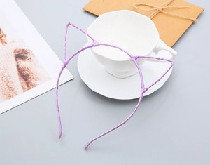 Detailed view of light purple cat ear headband on a white coffee cup background