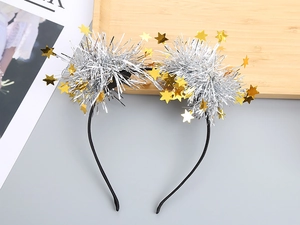 Detail of festive headband with silver tinsel balls and gold stars for party
