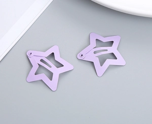 Close-up of lavender star-shaped hollow metal hair clips with matte finish in BB style