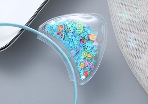 Detailed close-up of blue headband featuring transparent PVC cat ears with fruit sequins