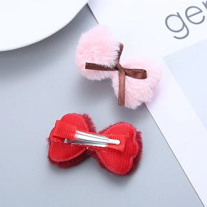 Pair of plush red and pink bow hair clips for girls with comfortable ribbon-wrapped metal grips