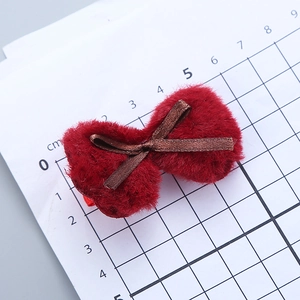 Kids plush red bow hair clip with brown ribbon detail for festive winter occasions