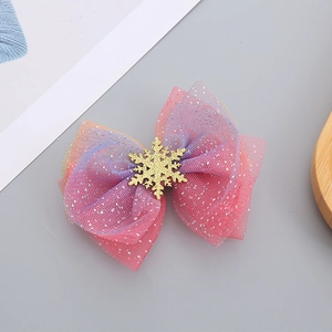 Pink and purple gradient glitter mesh bow hair clip with gold snowflake accent for girls