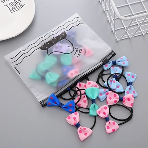 50-piece set of girls' floral bow hair ties with elastic bands in a frosted gift bag