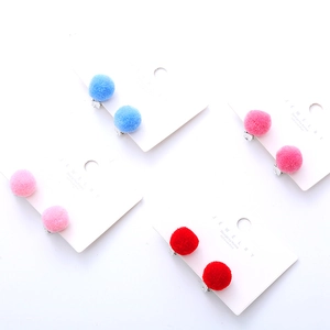 Cute candy-colored plush pom-pom clip-on earrings for kids in various pastel colors
