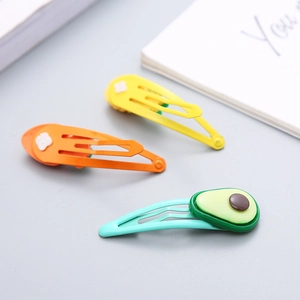 Set di 3 fermagli per capelli in resina colorata con motivi di avocado e fiori bianchi