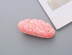 Close-up of pink glitter cloud hair clip for girls with sparkling sequins and small rhinestones