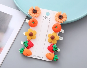 Detailed view of 10-piece kids hair clips set with cute resin fruit and flower designs