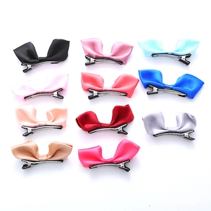 Lot de 11 jolies barrettes à nœuds en satin pour filles en couleurs variées sur fond blanc