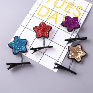 Sparkly star spring hair clips in macaron colors for kids on a minimalist background