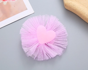 Detail view of pink heart hair clip with pleated mesh tulle for girls and kids