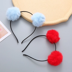 Cute girls' headbands with fluffy pom-poms in red and blue for festive occasions