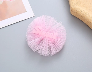 Detail of pink mesh lace hair clip featuring a sweet letter heart center for girls