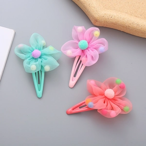 Three-piece colorful floral gauze hair clips for girls featuring cute pom-pom centers