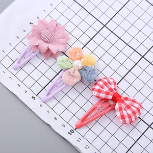 Three-piece set of girls' floral hair clips with pink sunflower and plaid bow