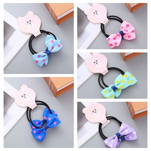 Detailed set of 5 colorful polka dot ribbon bow hair ties on bear shaped cards