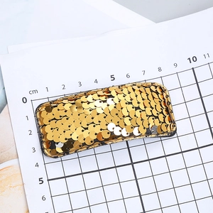 Rectangle hair clip with sparkling golden sequins and black fabric trim for girls