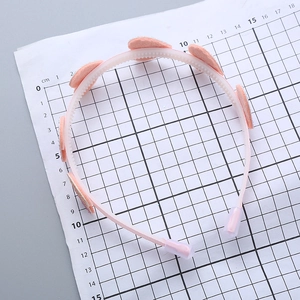 Cerchietto rosa per bambine con denti antiscivolo e decorazioni a cuore glitterato
