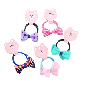 5-piece set of girls' elastic bow hair ties with printed patterns on a pink display card
