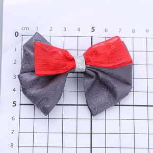 Fiocco per capelli bimba con paillettes rosse e tessuto a motivi scuri, misura 8.5cm
