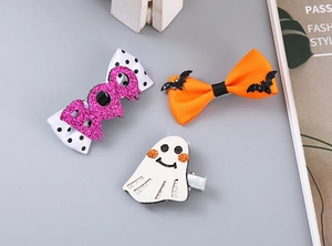 Three Halloween hair clips set featuring purple BOO bow, orange bat and white ghost