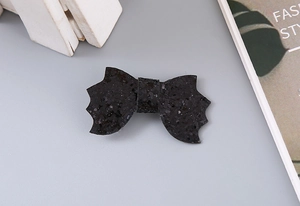 Detail of Halloween black glitter bat bow hair clip with shiny sequins for girls